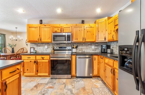 Hiawassee House | Riverfront cabin, arcade, hot tub, pool, trout fishing, pet friendly