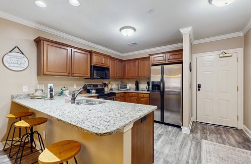 Helen Condo | Riverfront oasis with dual suites, 3 fireplaces, central AC, & walkable locale