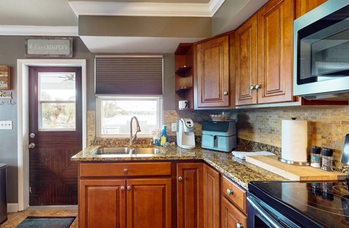 Mid Island House | Spacious home with heated pool, lots of outdoor entertainment, and WIFI