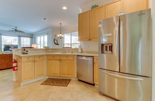 Biggar House | Spacious home with screened-in pool & lush lakefront views - minutes to beaches