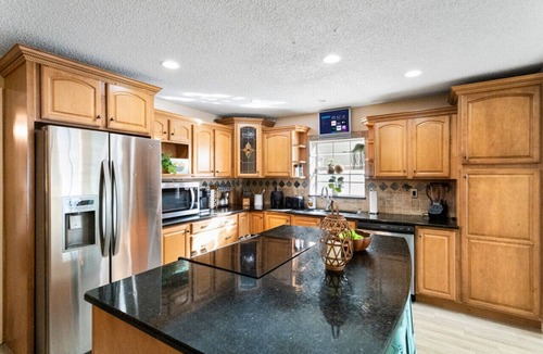 Pinellas Park House | Sun Coast Paradise: Fenced Terrace w/Pool, Spa. Gourmet Kitchen/Game Room Pets OK