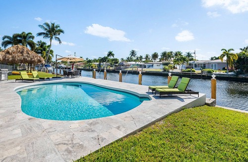 Garden Isles House | Sunny Canal, Modern waterfront 3 bedroom pool home