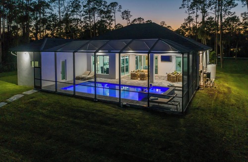 Rural Estates House | The Naples Luxe Retreat . Game Room Heated Pool