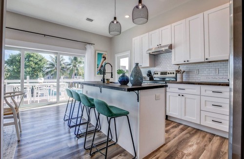 Cutthroat Harbor Estates House | The Salty Sailfish: Live the Keys Life, Stunning Canal Front Home, Pool, Dock & Dog-Friendly Bliss!
