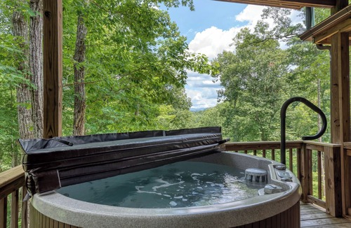 Townsend Cabin | This Amazing home has much to offer ,spacious rooms & and a hot-tub for relaxing