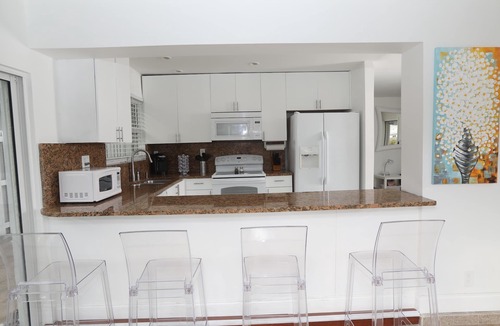 Melaleuca Gardens House | Tropical home with panoramic view of the canal. Fishing getaway near the ocean!