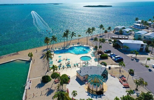 Cudjoe Key RV Rental | Tropical RV Lot Oasis in the Florida Keys with Paved Patio, Full Hookups & Palm-Tree Privacy