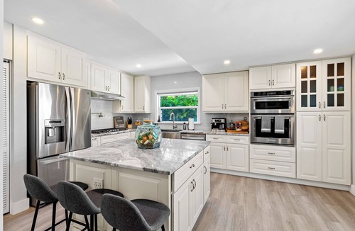 Tarpon River House | Tropical Waterfront Home - Pet Friendly & Heated Pool