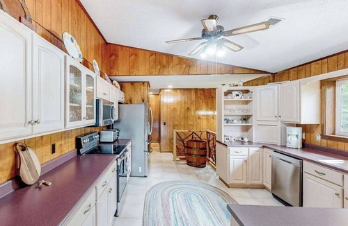 Franklin House | View-worthy home lined by trees with a fireplace, wrap-around deck, grill, & W/D