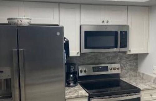 Stuart Condo | Water and Golf Course View Ocean Club Membership heated pool wifi