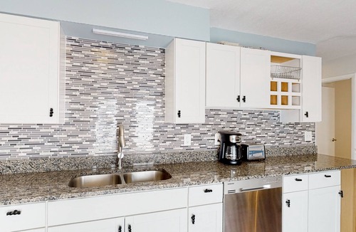 Bayview House | Water view home with five bedrooms, enclosed yard, gas grill, central AC, & W/D