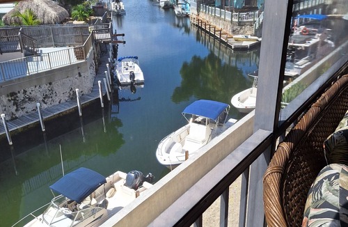 Cross Key Waterways Condo | Waterfront Condo with Boat; Great for Families, Fishing, Diving and Cruising!