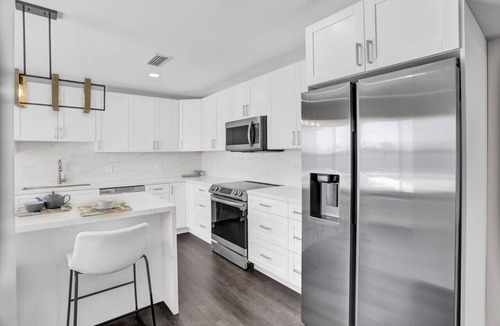 Seybold House | Waterfront Hot Tub, Heated Pool, Outdoor Lounge & Grill, King Beds