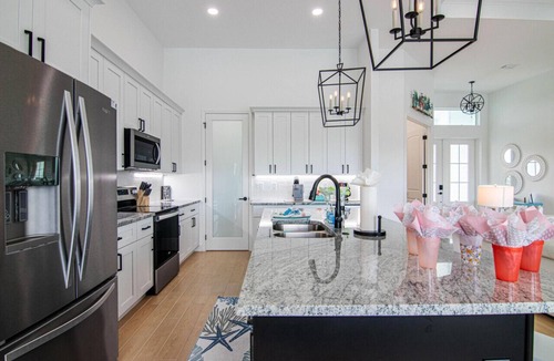 Pelican House | Waterside, Heated Saltwater Pool and Spa with Modern, Florida charm.