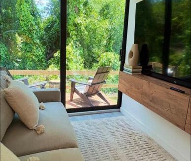 Estero House | Zen Container Tiny Home with Fenced-in Yard, Fire Pit, Centrally located and Pet Friendly