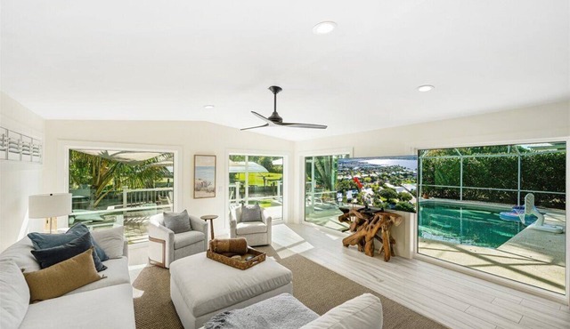 Beautiful 4BR, 3.5BA Stuart retreat with a private screened-in pool. Sleeps 9 and features two en-suite rooms, a modern kitchen, open living, and peaceful canal views perfect for bringing your fishing poles. Minutes to Downtown, dining, and beaches.