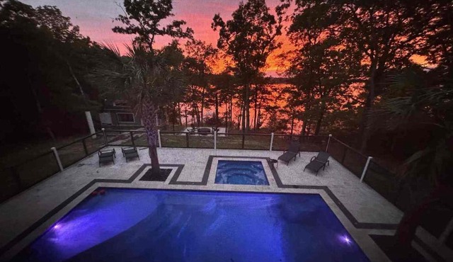 Impeccable Lakefront Luxury with Heated Pool, Hot Tub, Private Dock, Game room, Firepit & Sun Set in Amazing Location