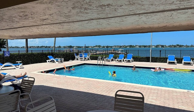 Modern Sunny & Cozy Waterfront Gem ~ Walk to Beach ~ Pool with Dock