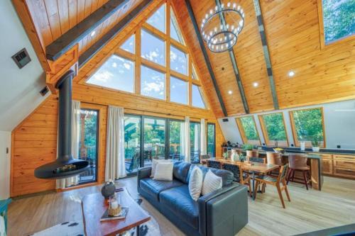 New Lux A-Frame Cabin near Dollywood! Hot Tub, Fire Pit, Pool & Mountain Vibes!