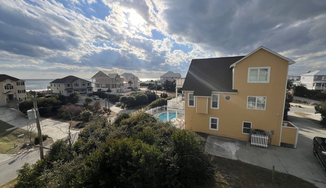 Relax in your private pool at your second-row Emerald Isle 4 BR beach cottage
