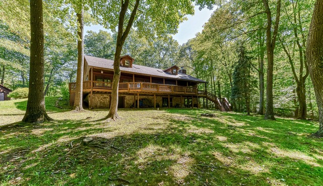 Updated cabin with wraparound deck & forest view - dog-friendly
