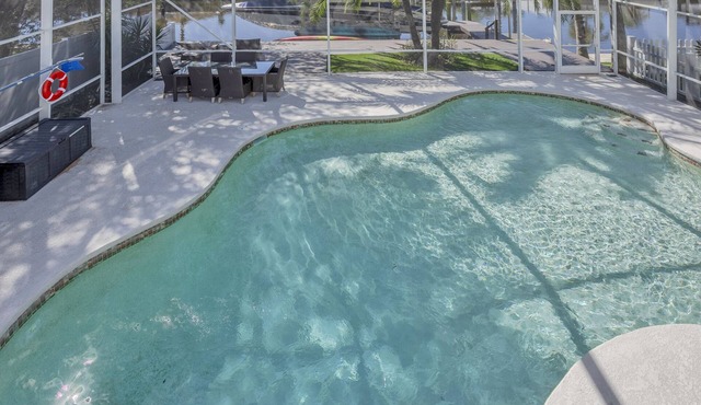 Waterfront Resort with screened HEATED POOL nestled in secluded Tampa Shores!