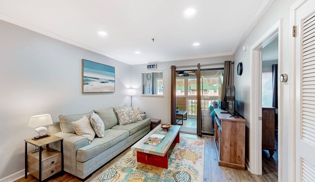 Waterfront villa with resort amenities, beach access, open layout, AC, & W/D
