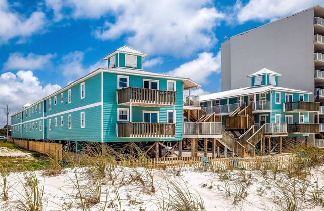 Beachside home steps from the water with pool access & central AC