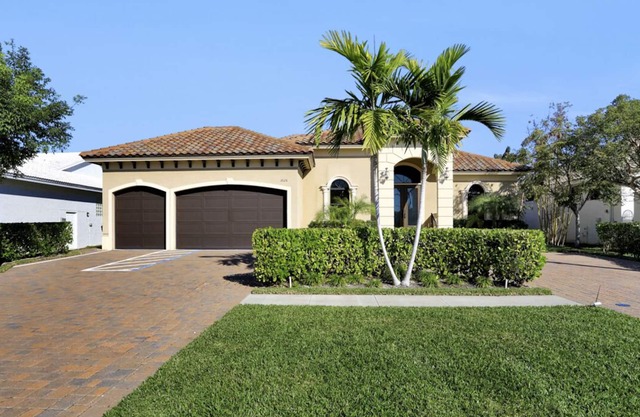 Picturesque waterfront home w/ heated pool, hot tub & outdoor kitchen