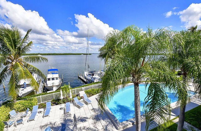 This beautiful unit has front row seats to the sunrise! Direct bayfront!