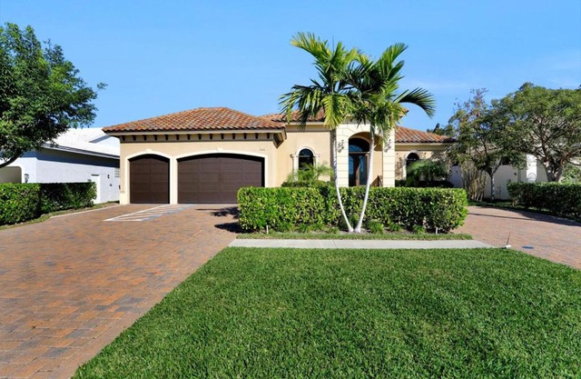 Waterfront home with pool, spa and outdoor kitchen