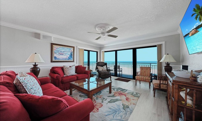 New Smyrna Beach Condo | Direct oceanfront corner condo with a large wrap around balcony and heated pool