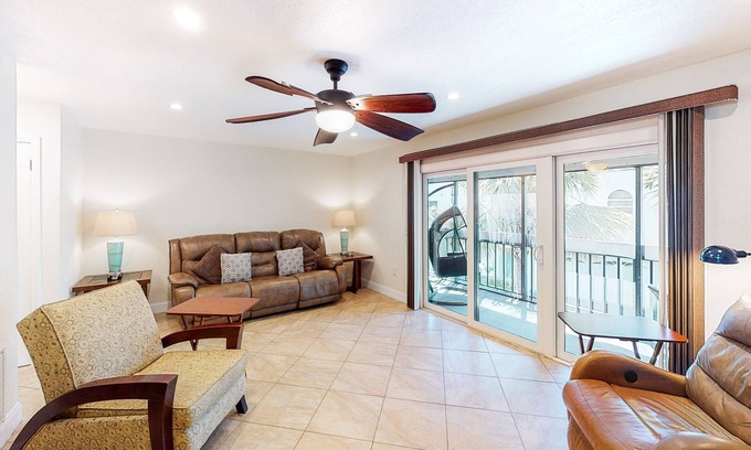 Indian Shores House | Townhouse Steps from the Beach with Screened Balcony, WiFi, AC & Shared Pools