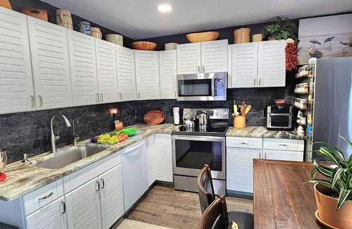 Palm City House | Key West Style - Two-Story Tiki Retreat